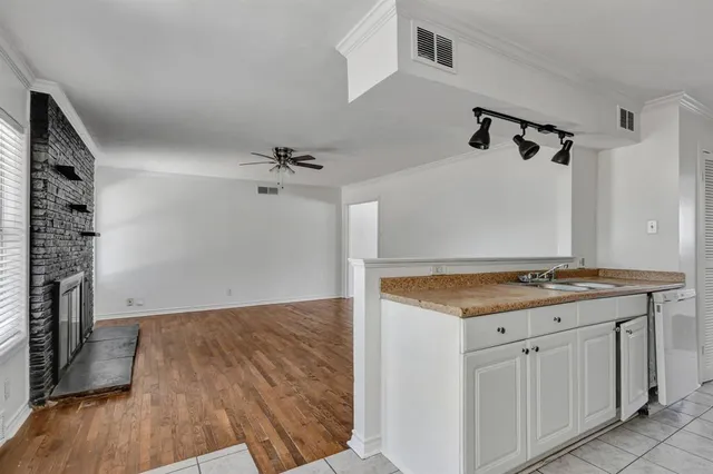 wooden floor in a kitchen with a stove
