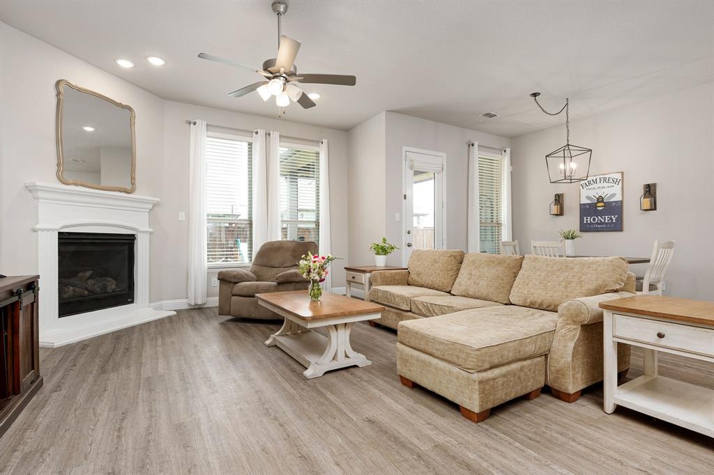 1320 Rosebush Road Aubrey, TX 76227 - Photo 12 of 33 a living room with furniture and a fireplace