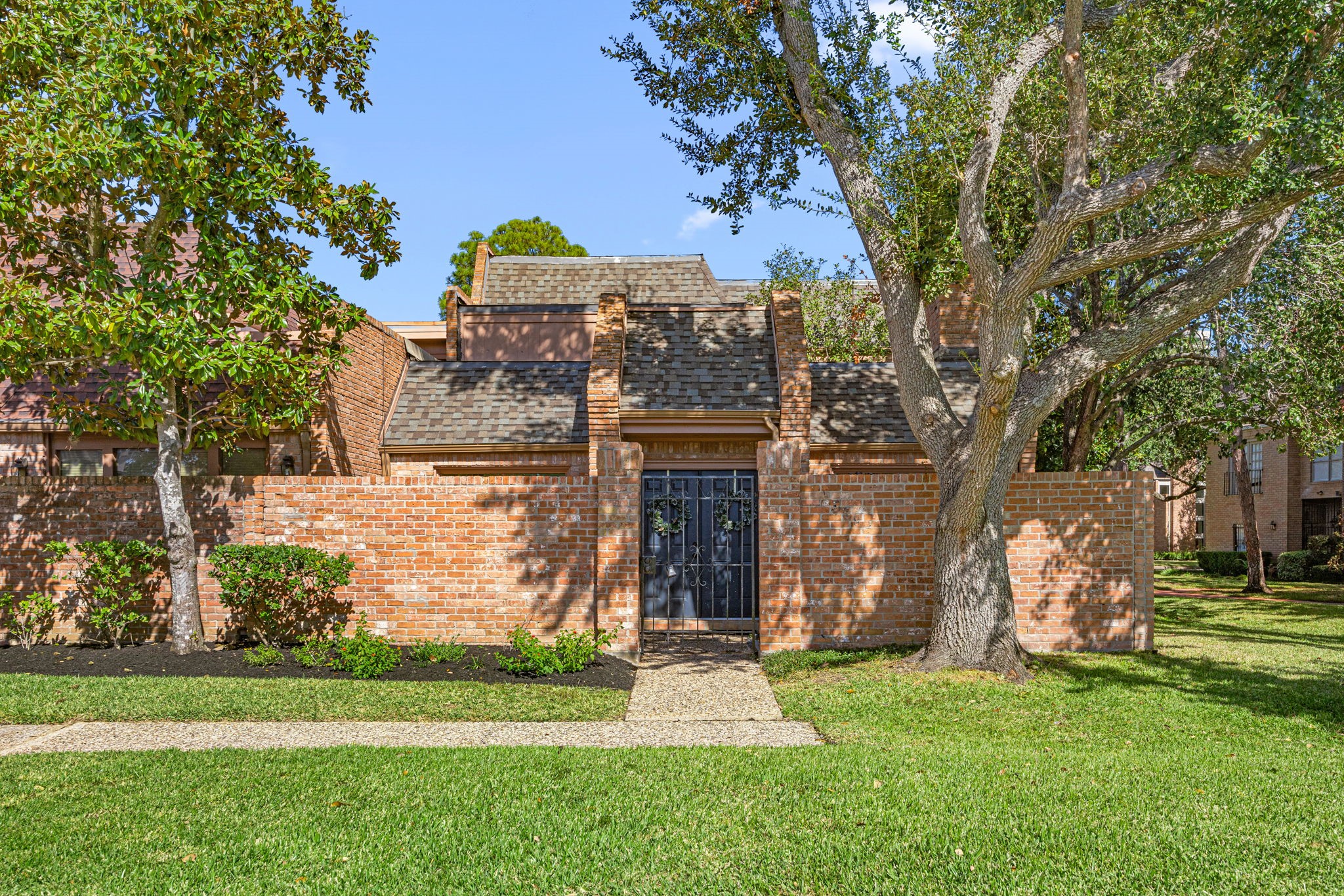 a front view of a house with garden