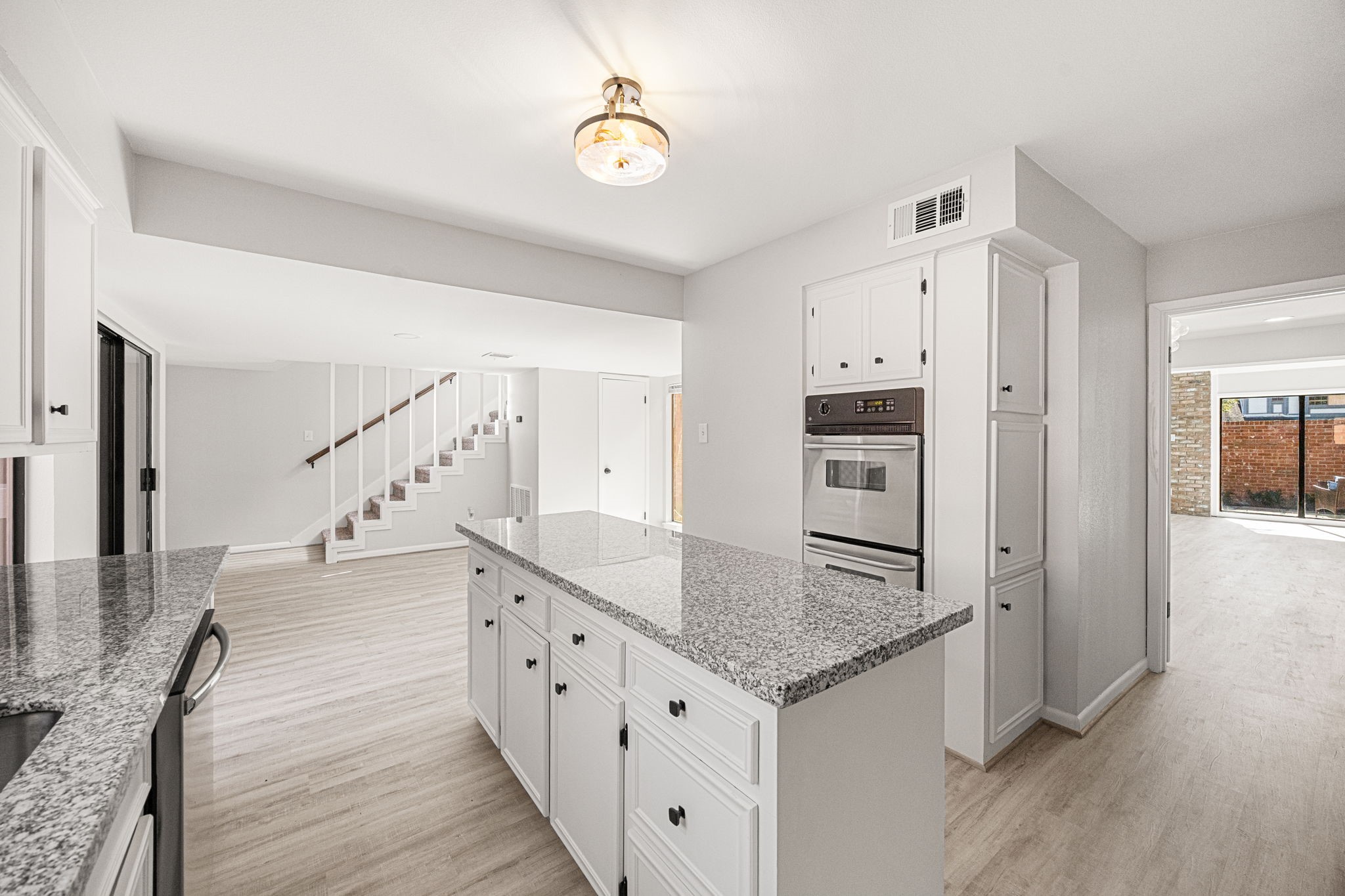 15686 Barkers Landing Road Houston, TX 77079 - Photo 16 of 32 a kitchen with stainless steel appliances granite countertop a refrigerator and a sink