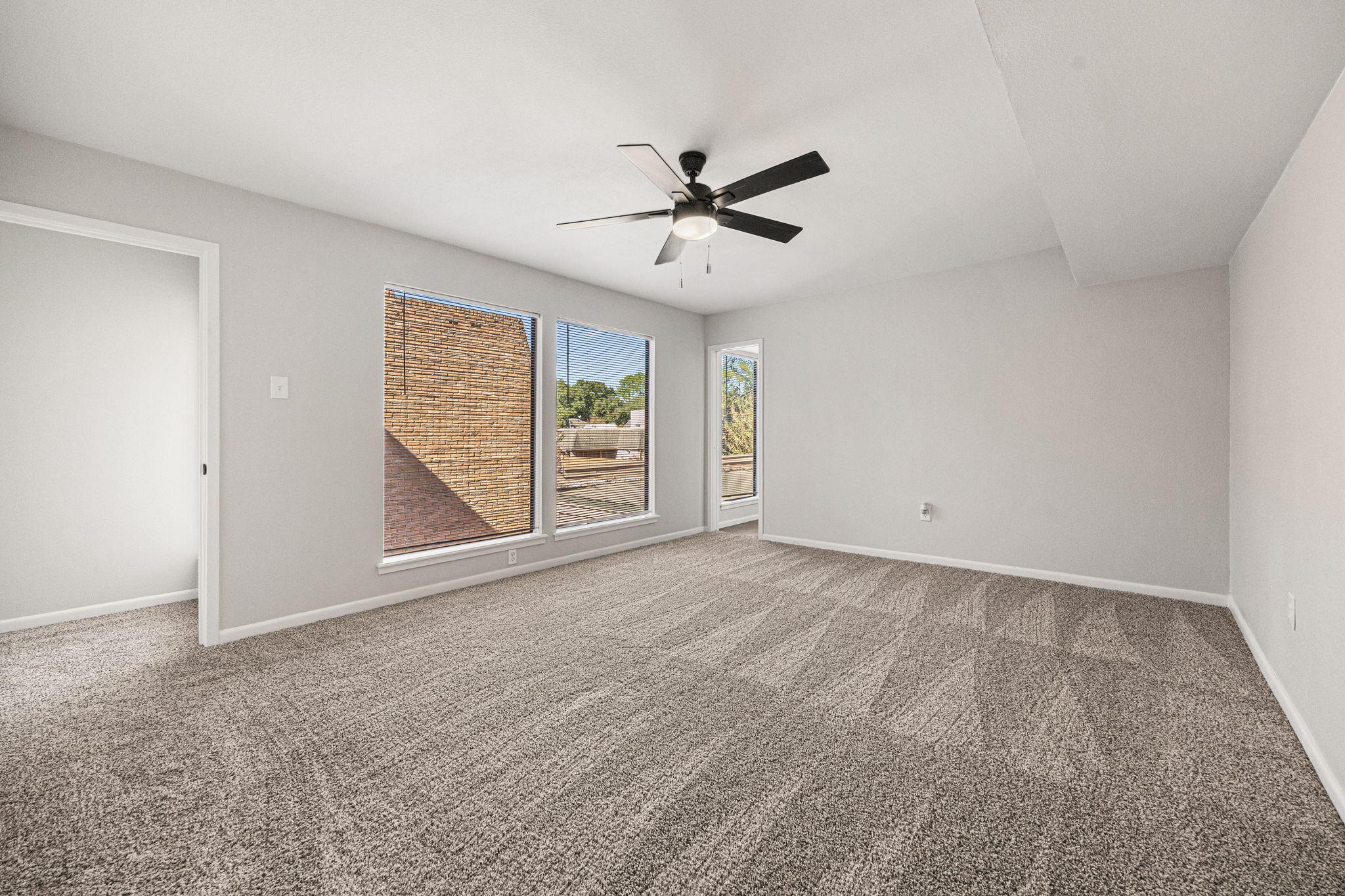 15686 Barkers Landing Road Houston, TX 77079 - Photo 21 of 32 wooden floor in an empty room with a window