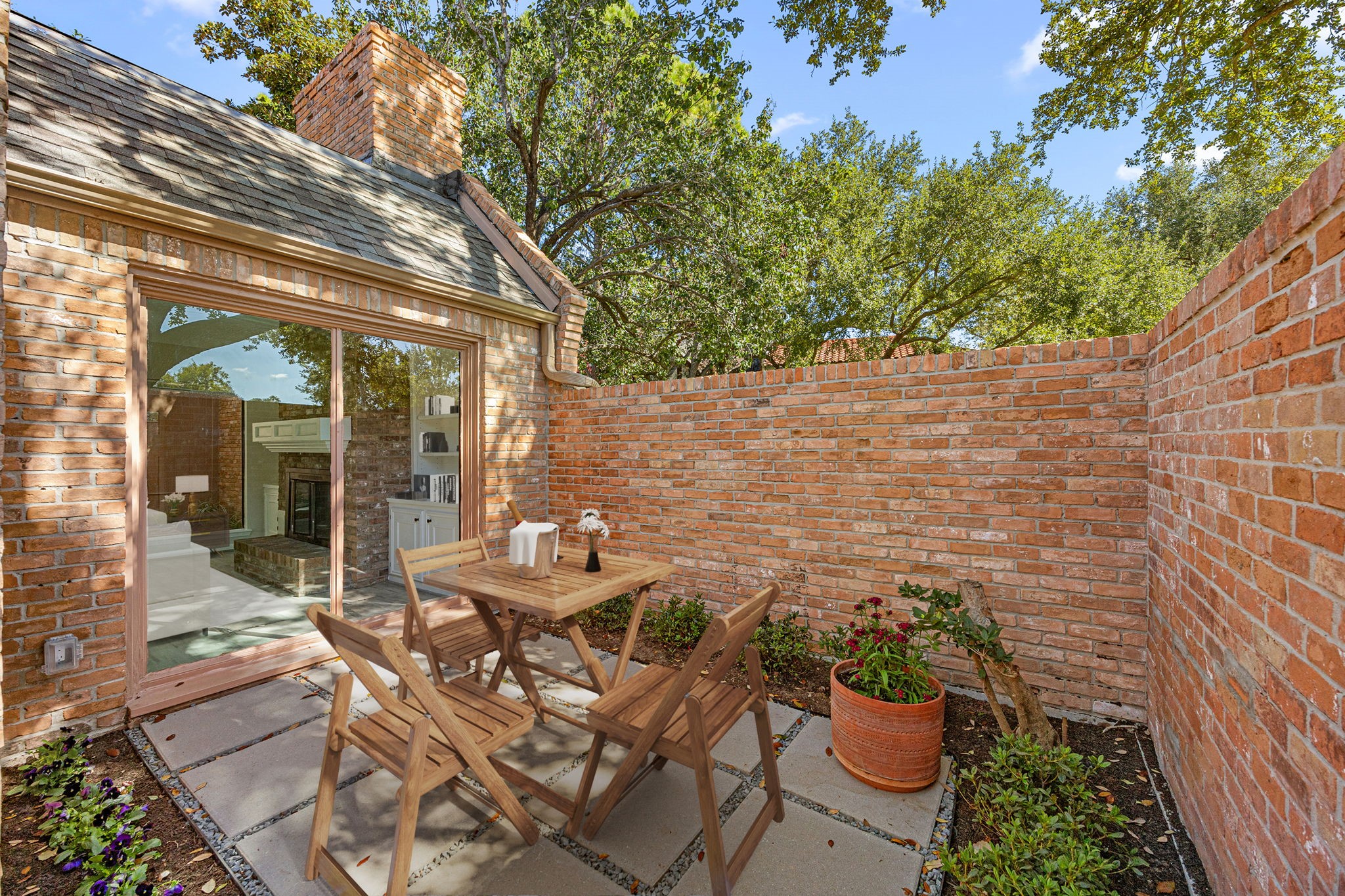 15686 Barkers Landing Road Houston, TX 77079 - Photo 3 of 32 a view of a patio with table and chairs potted plants