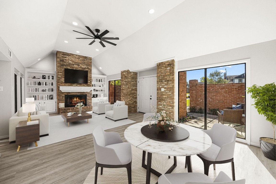15686 Barkers Landing Road Houston, TX 77079 - Photo 6 of 32 Guests are greeted through the double door entrance into the Family Room w/ Built-ins & gas fire place. Large windows allow natural light to flow throughout. Den area seamlessly opens to the Family Room & Formal Dining Area.