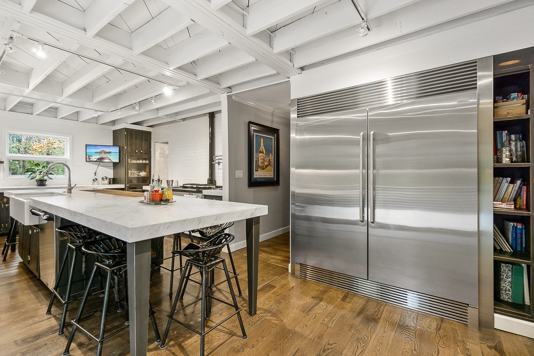1180 Mt Vernon Road Cookeville, TN 38501 - Photo 12 of 48 a kitchen with a table chairs and refrigerator