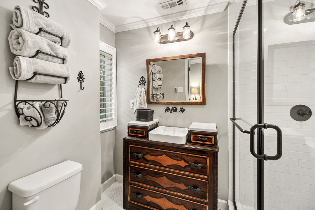 1180 Mt Vernon Road Cookeville, TN 38501 - Photo 27 of 48 a bathroom with a toilet sink and mirror