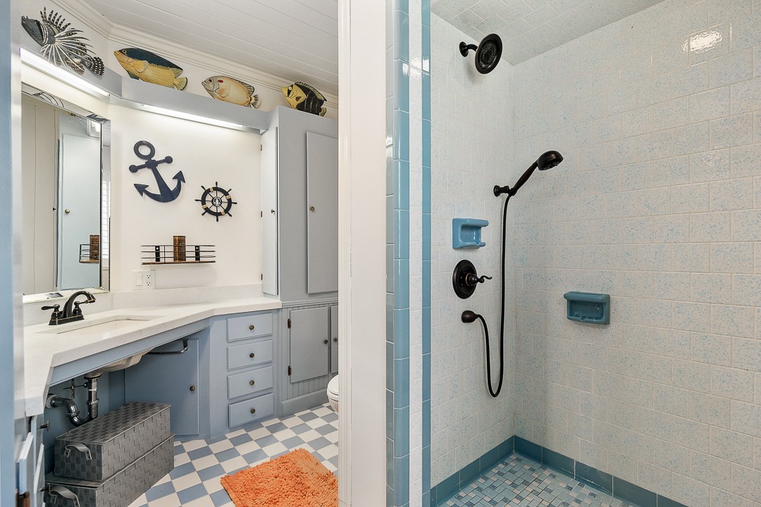 1180 Mt Vernon Road Cookeville, TN 38501 - Photo 36 of 48 a bathroom with a granite countertop sink a mirror and shower