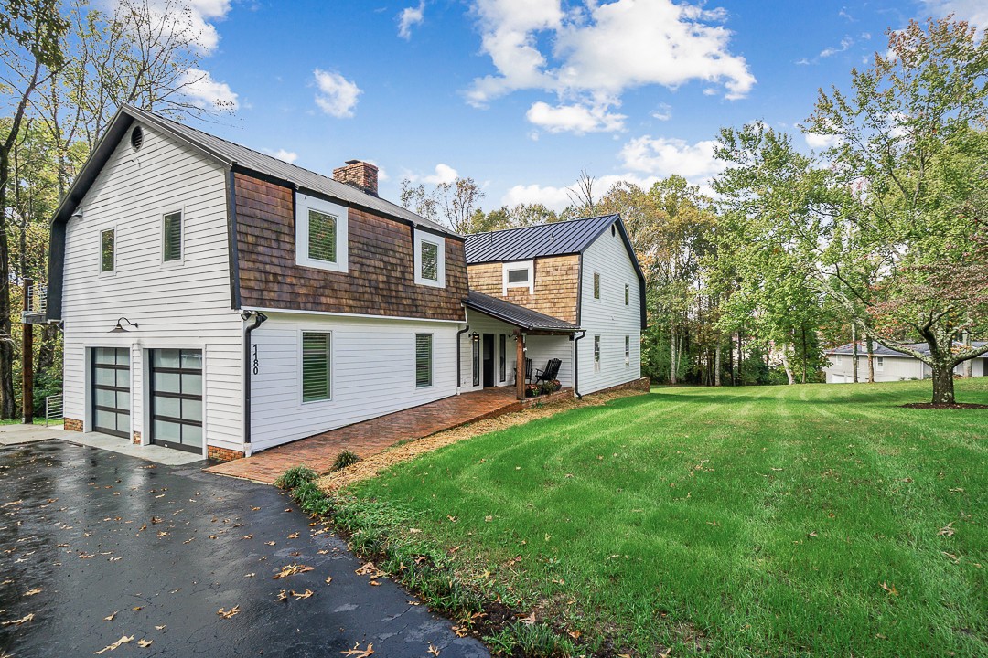 1180 Mt Vernon Road Cookeville, TN 38501 - Photo 39 of 48 a front view of house with yard and trees in the background
