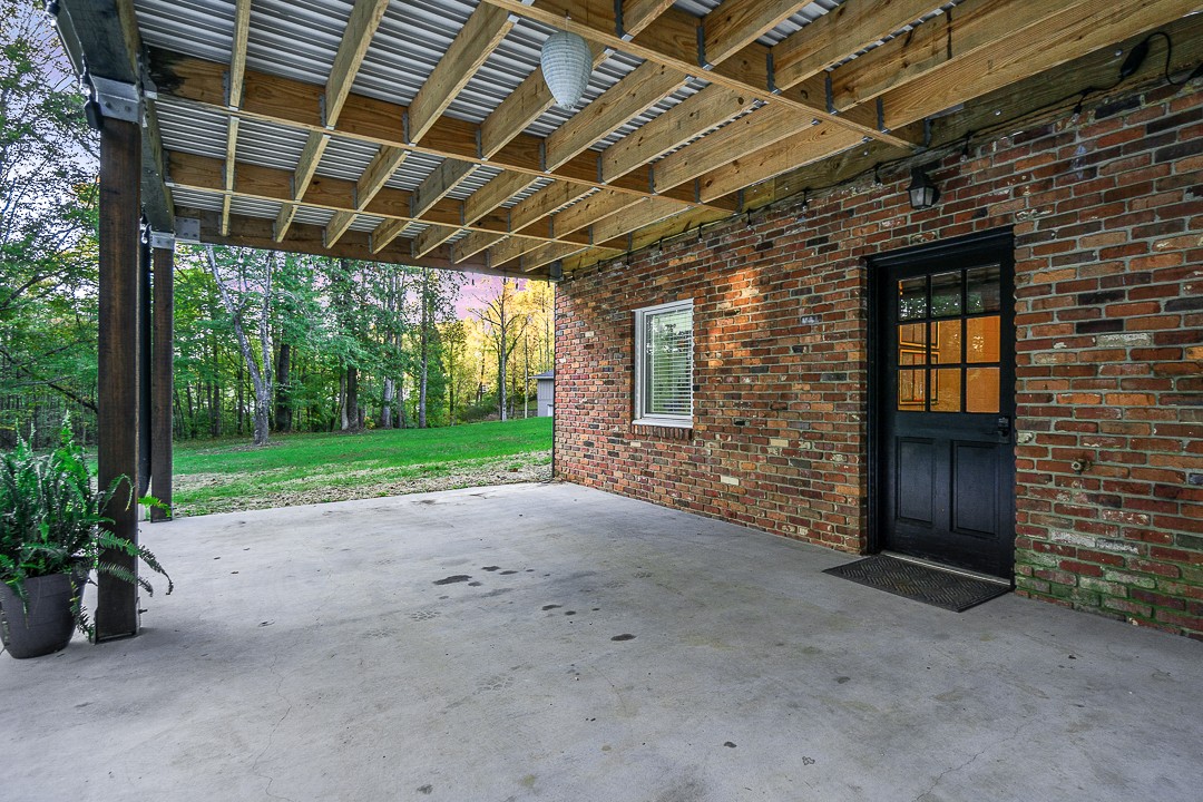1180 Mt Vernon Road Cookeville, TN 38501 - Photo 45 of 48 a view of a house with backyard and porch