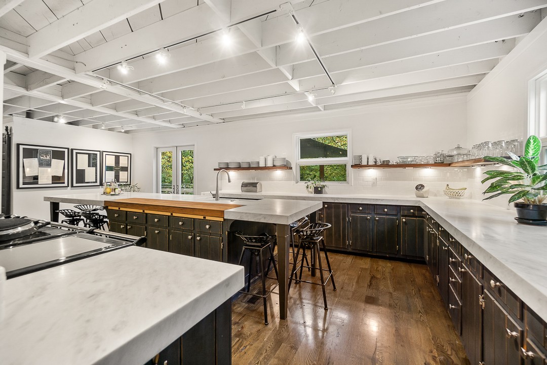 1180 Mt Vernon Road Cookeville, TN 38501 - Photo 7 of 48 a kitchen with a table chairs sink and cabinets