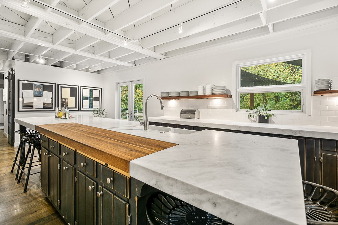 1180 Mt Vernon Road Cookeville, TN 38501 - Photo 10 of 48 a kitchen with a stove a sink and a refrigerator