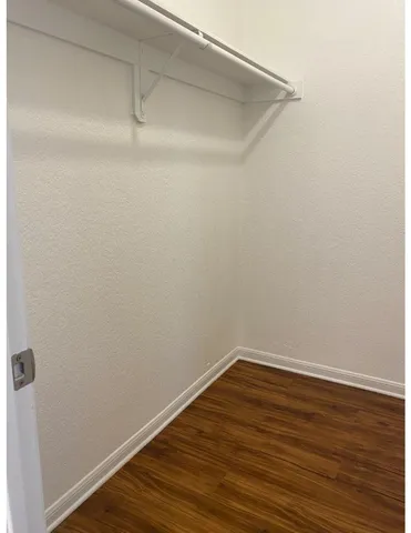 a view of a small space with wooden floor