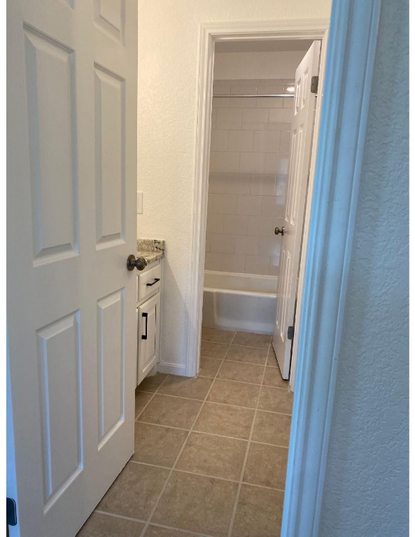 201 East 35th Street, Unit A Austin, TX 78705 - Photo 21 of 25 a bathroom with a tub and a sink