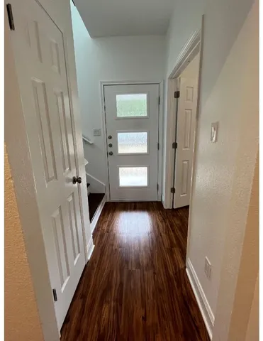 a view of entryway with wooden floor