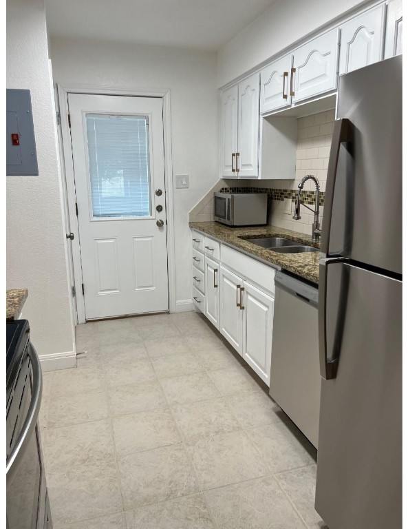 201 East 35th Street, Unit A Austin, TX 78705 - Photo 8 of 25 a kitchen with a refrigerator and a sink