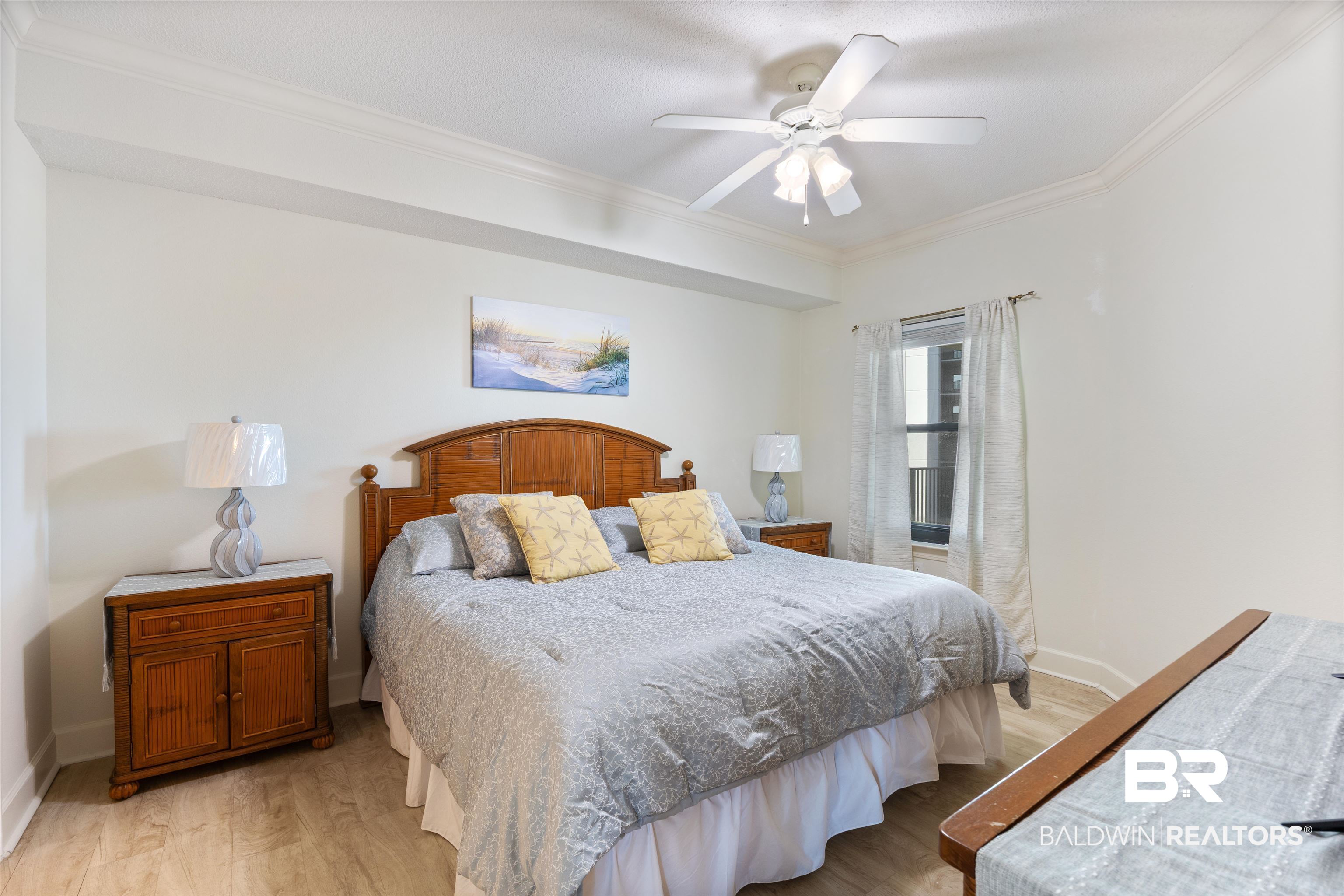 27580 Canal Road, Unit 1431 Orange Beach, AL 36561 - Photo 22 of 73 Bedroom featuring crown molding, light wood-style flooring, and ceiling fan