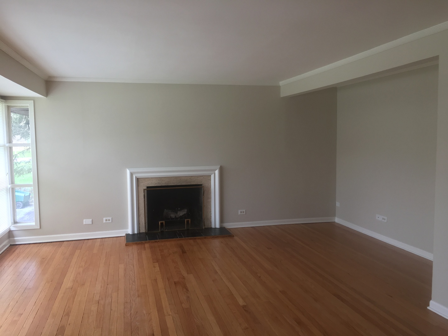 3203 Sprucewood Road Wilmette, IL 60091 - Photo 7 of 8 an empty room with wooden floor and a window