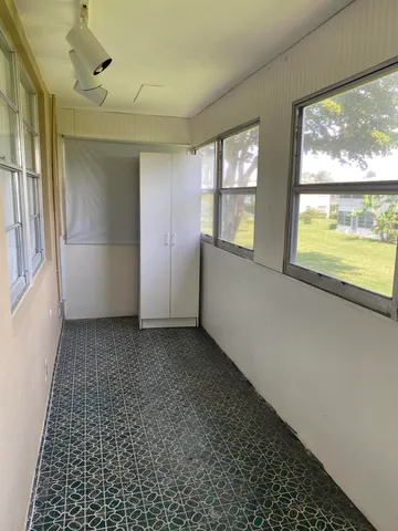 a view of an empty room and window