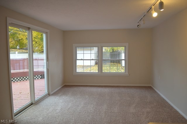 3726 Strandhill Road Shaker Heights, OH 44122 - Photo 9 of 31 1st floor family room with carpeting and sliders to large deck and fenced yard.