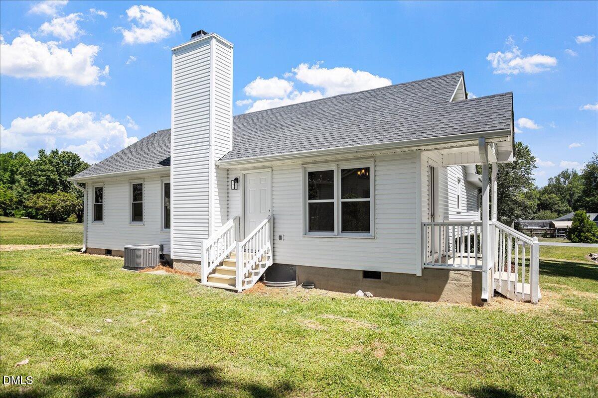 31 Fieldview Court Angier, NC 27501 - Photo 22 of 25 a house view with a sitting space and garden space