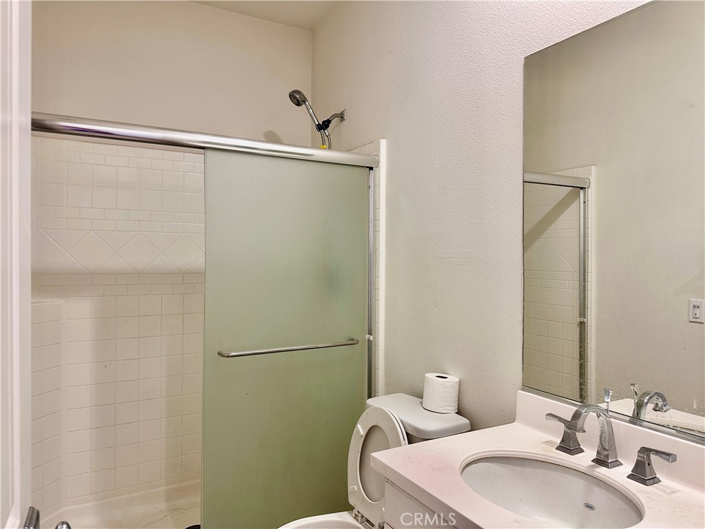 14807 Harmony Lane Westminster, CA 92683 - Photo 6 of 10 a bathroom with a sink and mirror