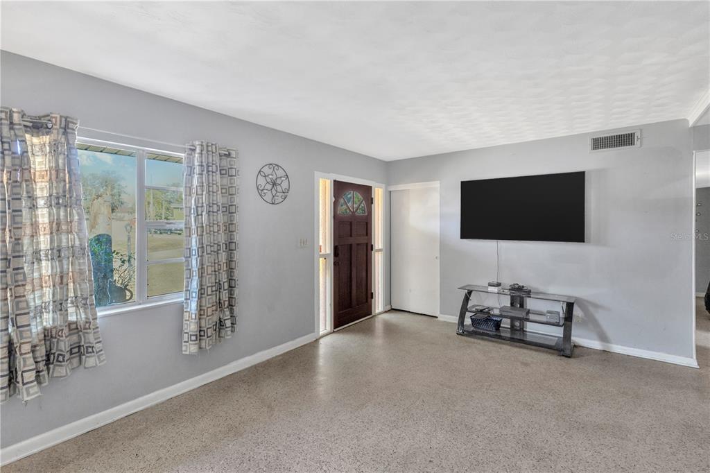 310 Kenmore Road Brandon, FL 33511 - Photo 5 of 33 a view of a livingroom with furniture and a flat screen tv