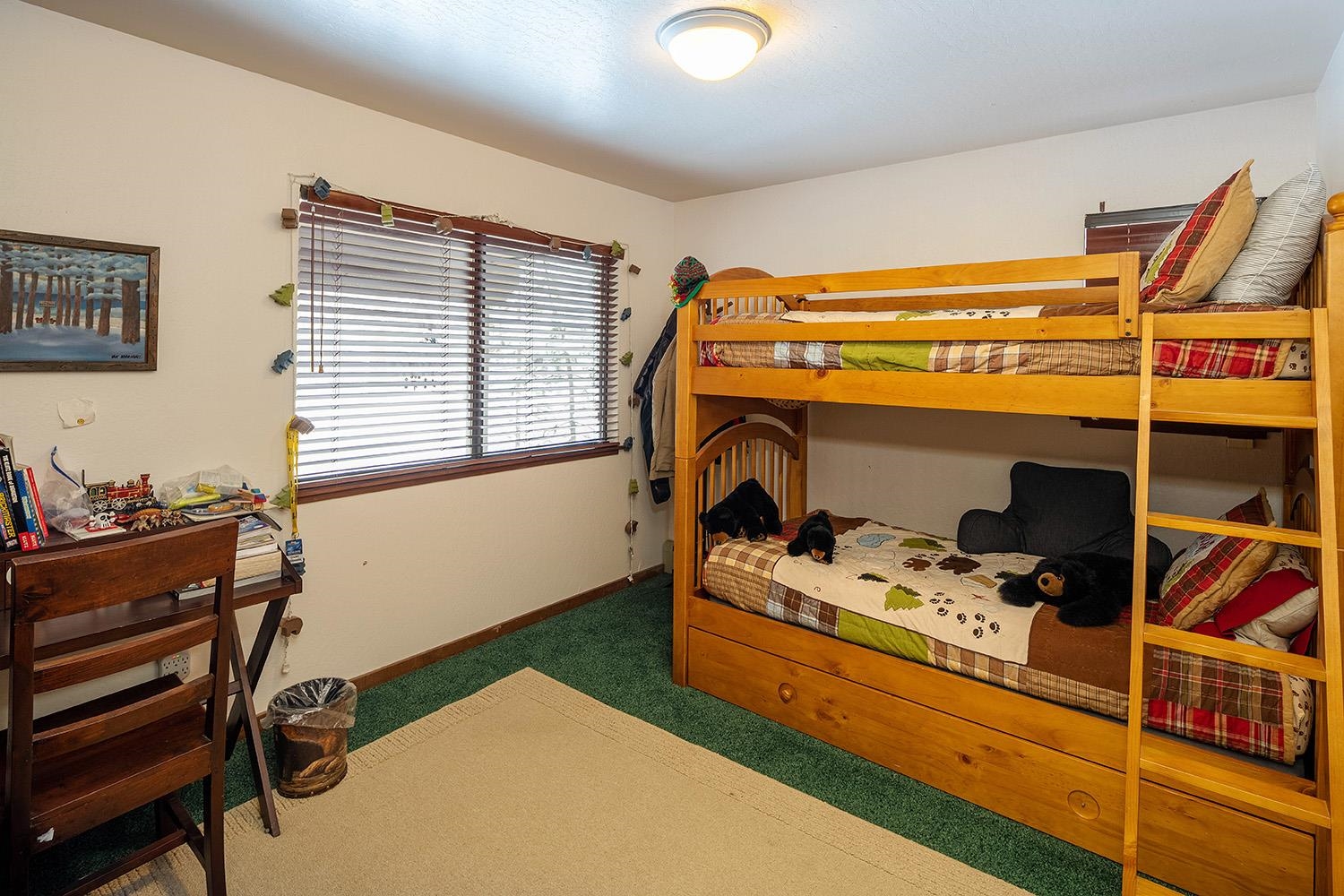 148 Basque Drive Truckee, CA 96161 - Photo 13 of 21 a bedroom with a bunk bed and a window