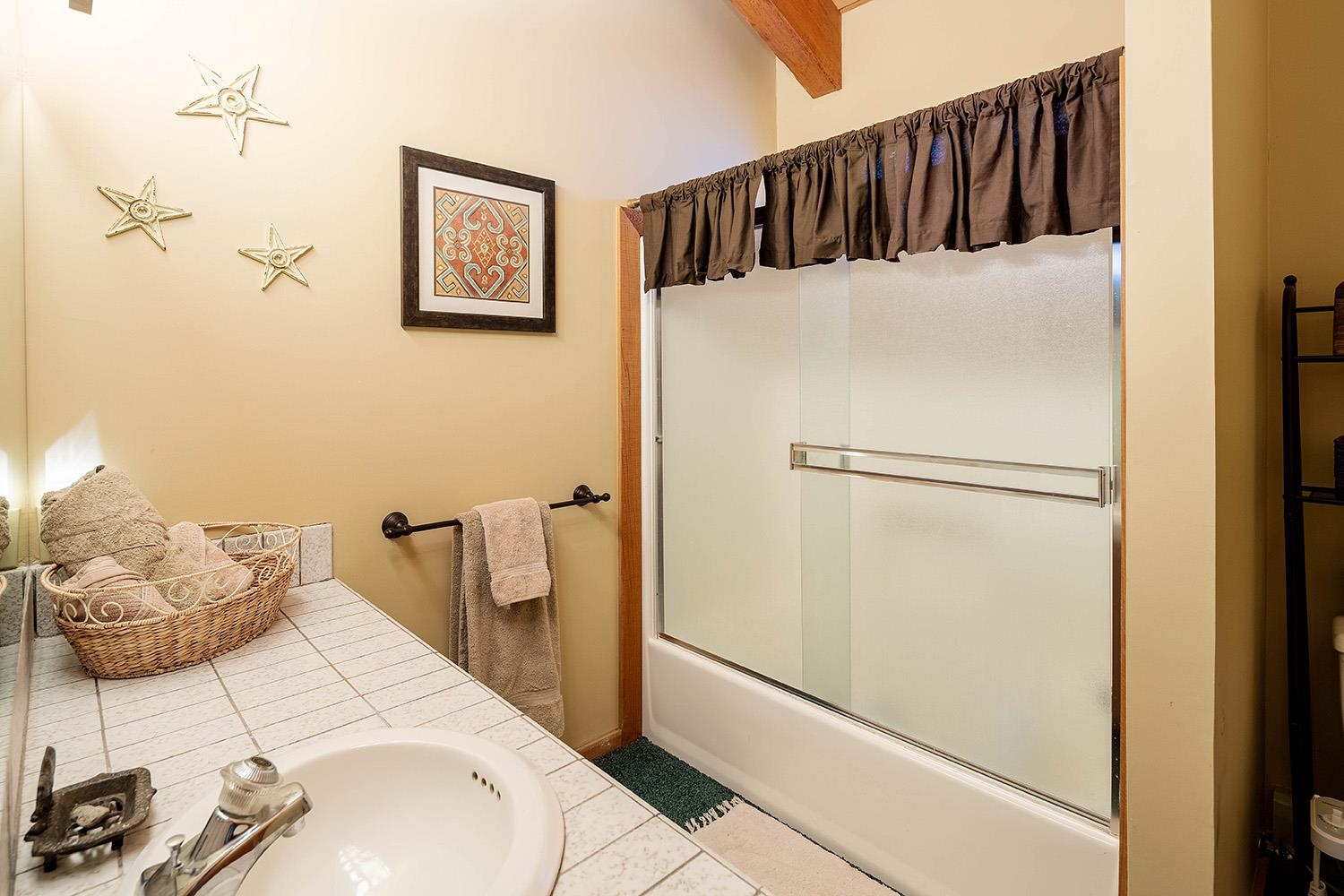 148 Basque Drive Truckee, CA 96161 - Photo 8 of 21 a bedroom with a bed and a refrigerator