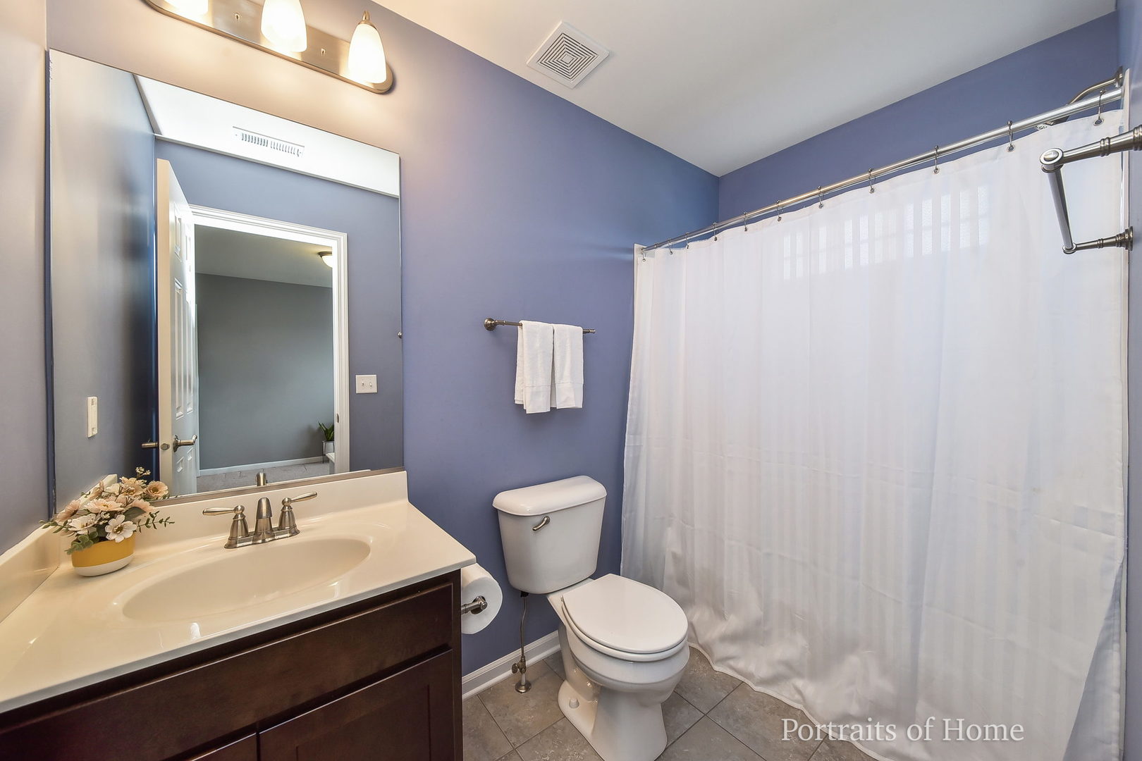 40W195 Palmer Road Geneva, IL 60134 - Photo 18 of 24 a bathroom with a sink a toilet and a mirror