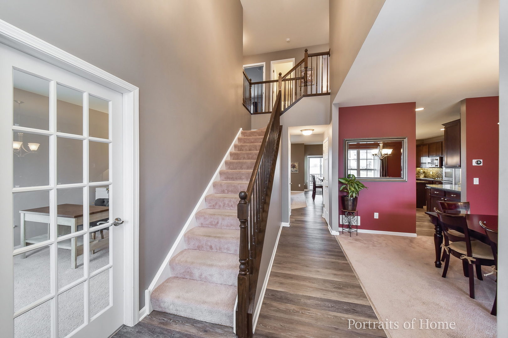 40W195 Palmer Road Geneva, IL 60134 - Photo 3 of 24 a view of a hallway with wooden floor and staircase