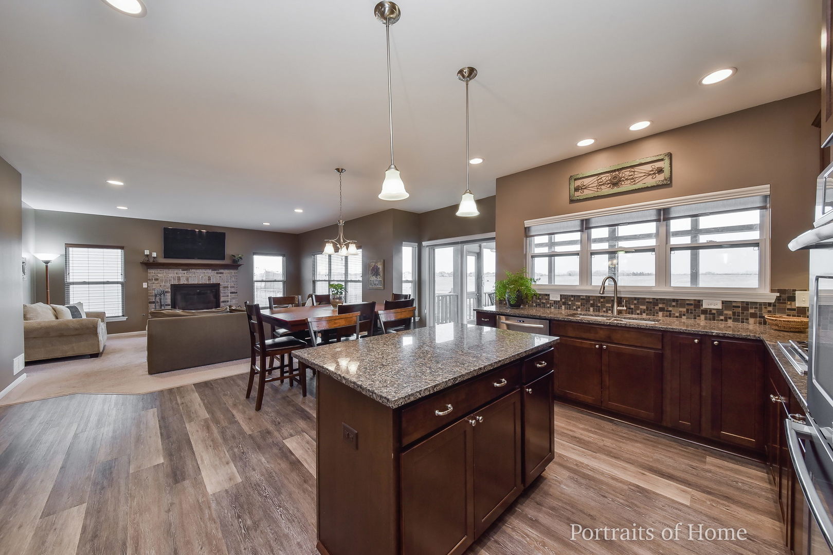 40W195 Palmer Road Geneva, IL 60134 - Photo 8 of 24 a kitchen with kitchen island granite countertop a stove and a wooden floors