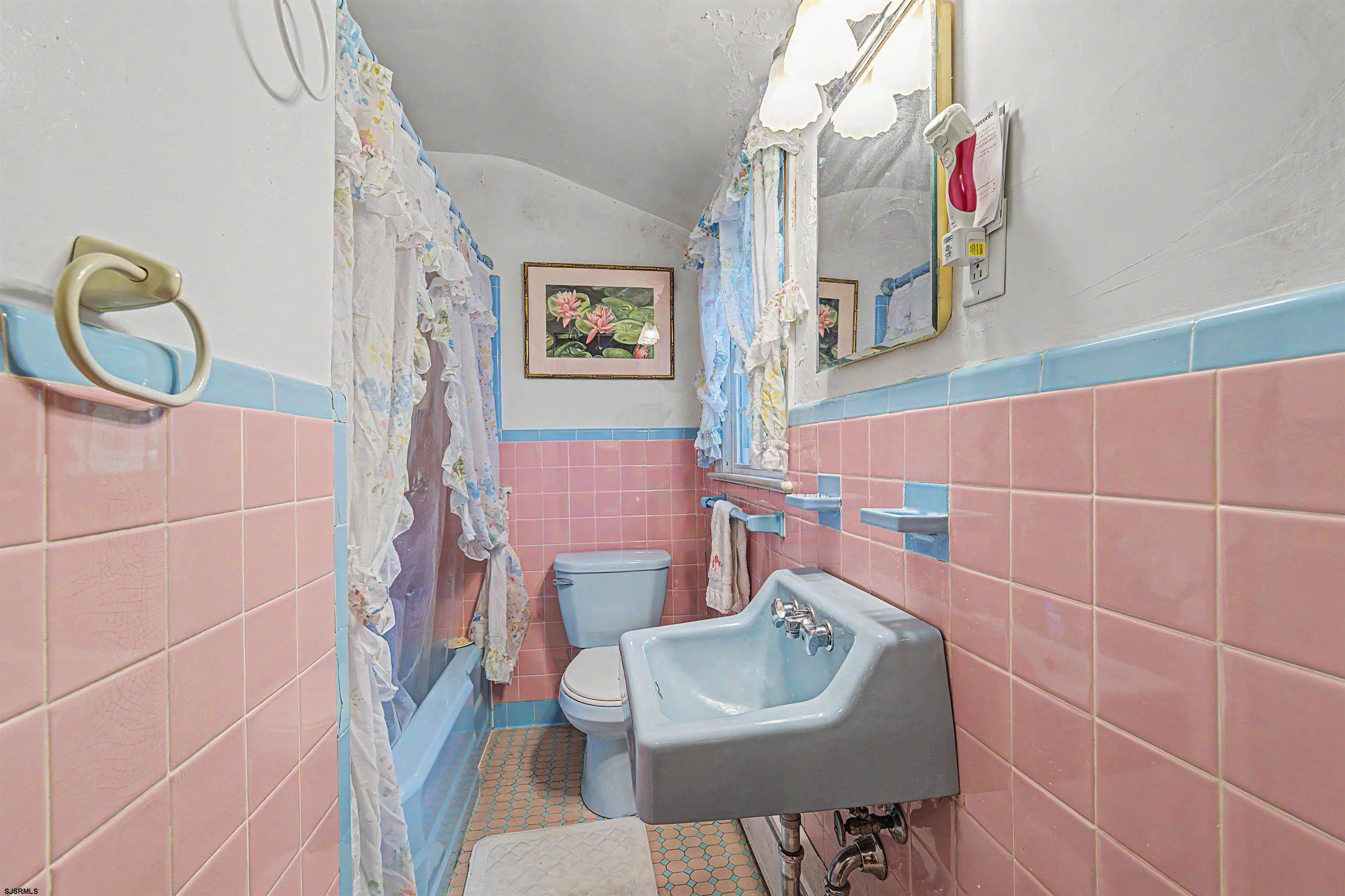 144 Pitney Road Absecon, NJ 08201 - Photo 27 of 47 a bathroom with a sink toilet and mirror