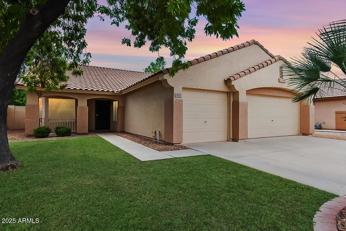 1563 East Robinson Way Chandler, AZ 85225 - Photo 1 of 21 a front view of house with yard and green space