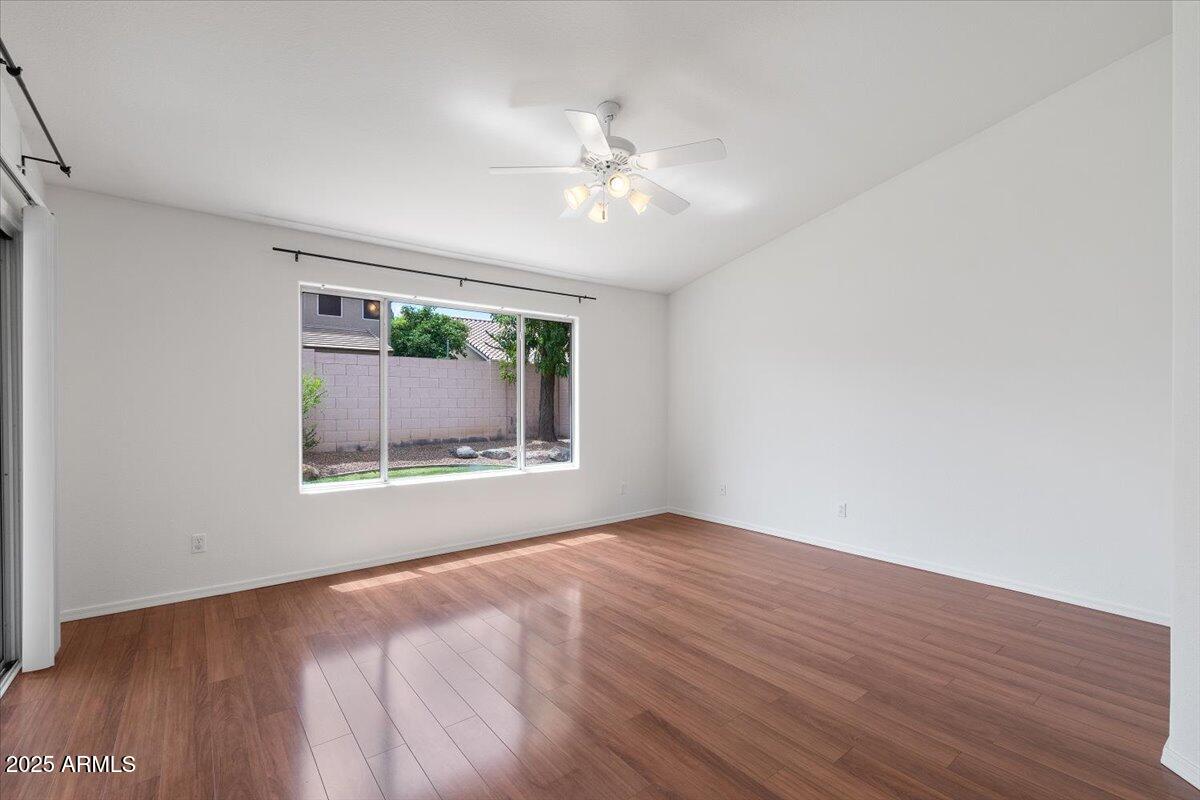 1563 East Robinson Way Chandler, AZ 85225 - Photo 11 of 21 a view of an empty room with wooden floor and a window