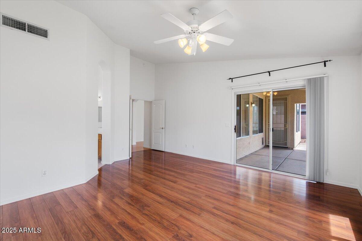 1563 East Robinson Way Chandler, AZ 85225 - Photo 13 of 21 an empty room with wooden floor and window