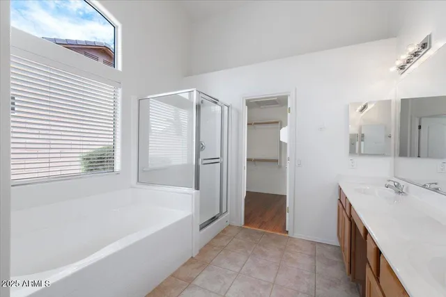 a spacious bathroom with a bathtub and a sink