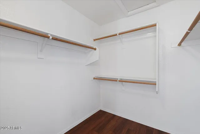 a view of an empty walk in closet
