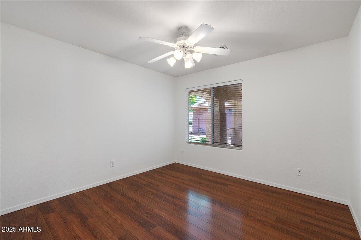 1563 East Robinson Way Chandler, AZ 85225 - Photo 16 of 21 a view of an empty room with wooden floor and a window