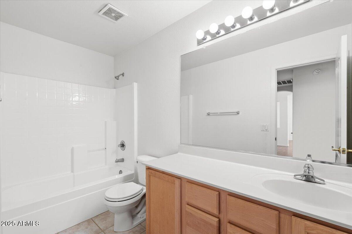 1563 East Robinson Way Chandler, AZ 85225 - Photo 18 of 21 a bathroom with a sink a toilet and shower