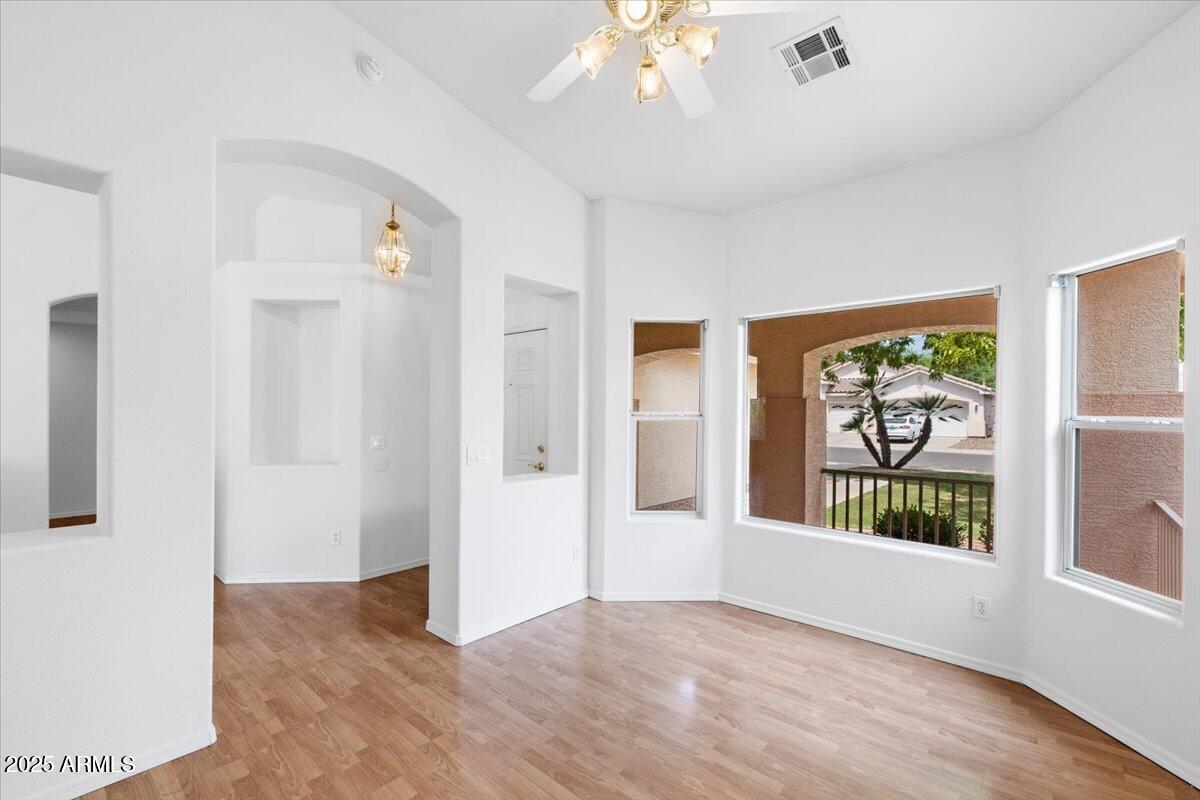 1563 East Robinson Way Chandler, AZ 85225 - Photo 8 of 21 wooden floor in an empty room with a window