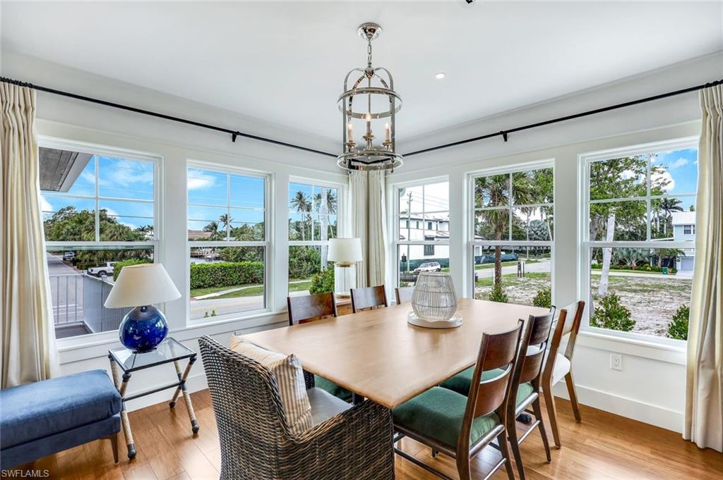 1437 Sandpiper Street Naples, FL 34102 - Photo 11 of 38 a view of a dining room with furniture window and outside view