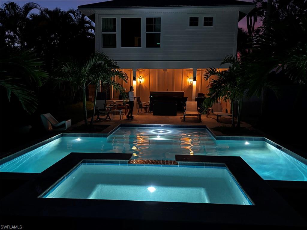 1437 Sandpiper Street Naples, FL 34102 - Photo 38 of 38 a view of a pool in a backyard