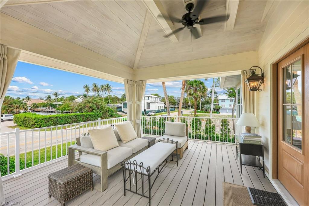 1437 Sandpiper Street Naples, FL 34102 - Photo 7 of 38 a view of balcony with furniture