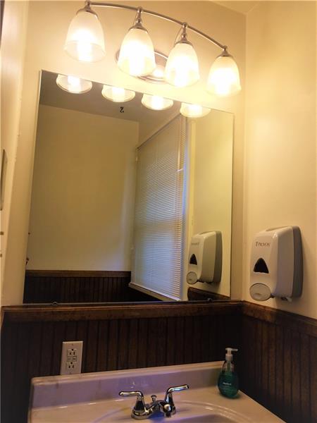 207 Reo Street Butler, PA 16001 - Photo 16 of 25 Upscale amenities in this bathroom with modern lighting, auto soap dispenser and gorgeous cabinet under sink.