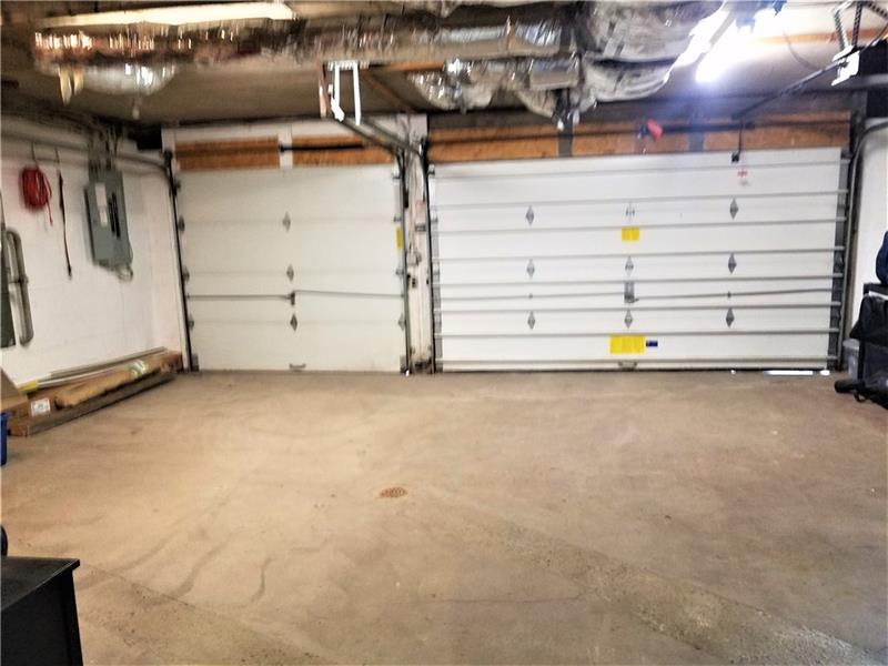 207 Reo Street Butler, PA 16001 - Photo 20 of 25 Wonderful 3 stall garage with auto opener, heat and 1/2 bath. Lots of storage and work bench. Man door from walk way.