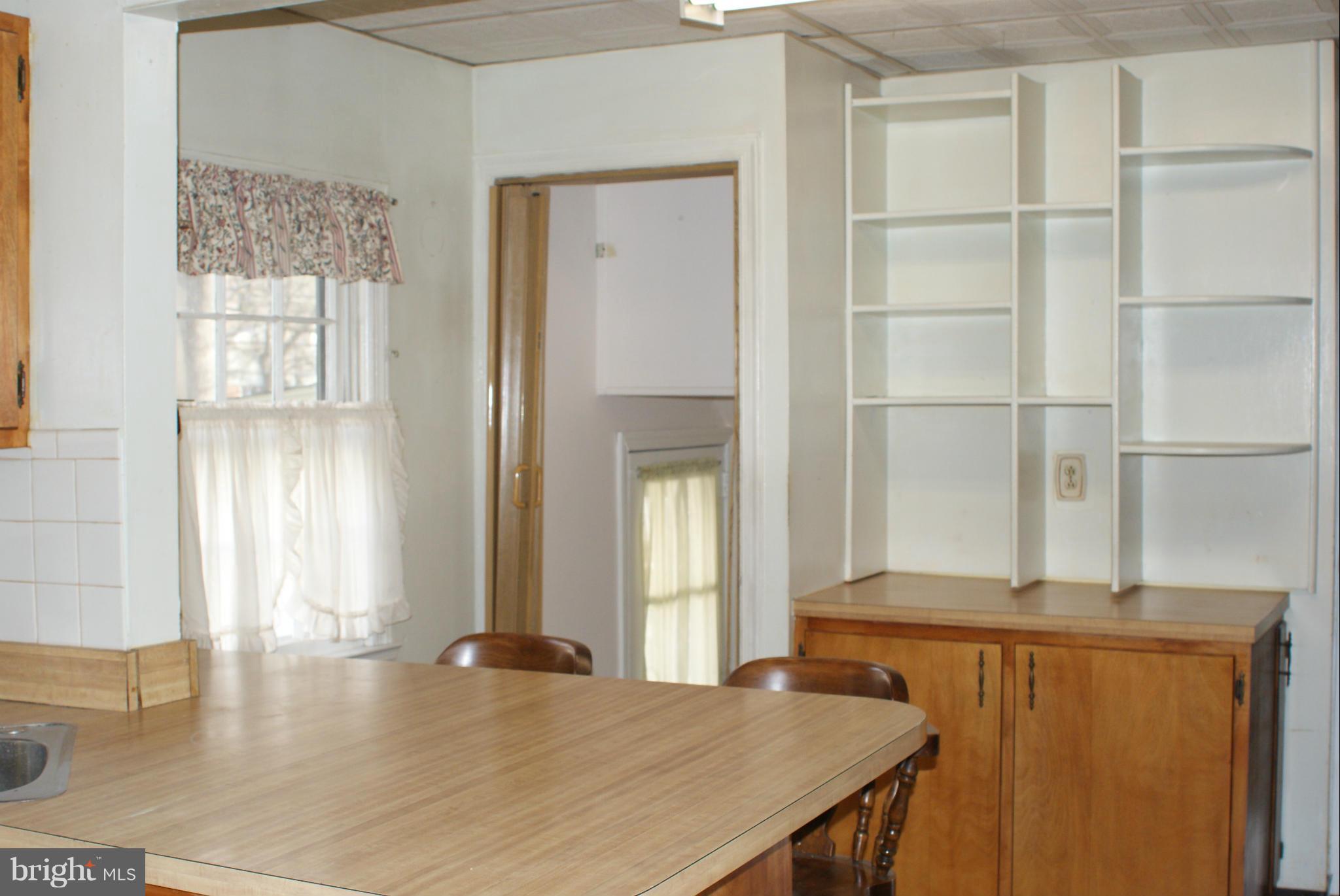 4505 Mahan Road Silver Spring, MD 20906 - Photo 7 of 22 a view of a kitchen with furniture and window