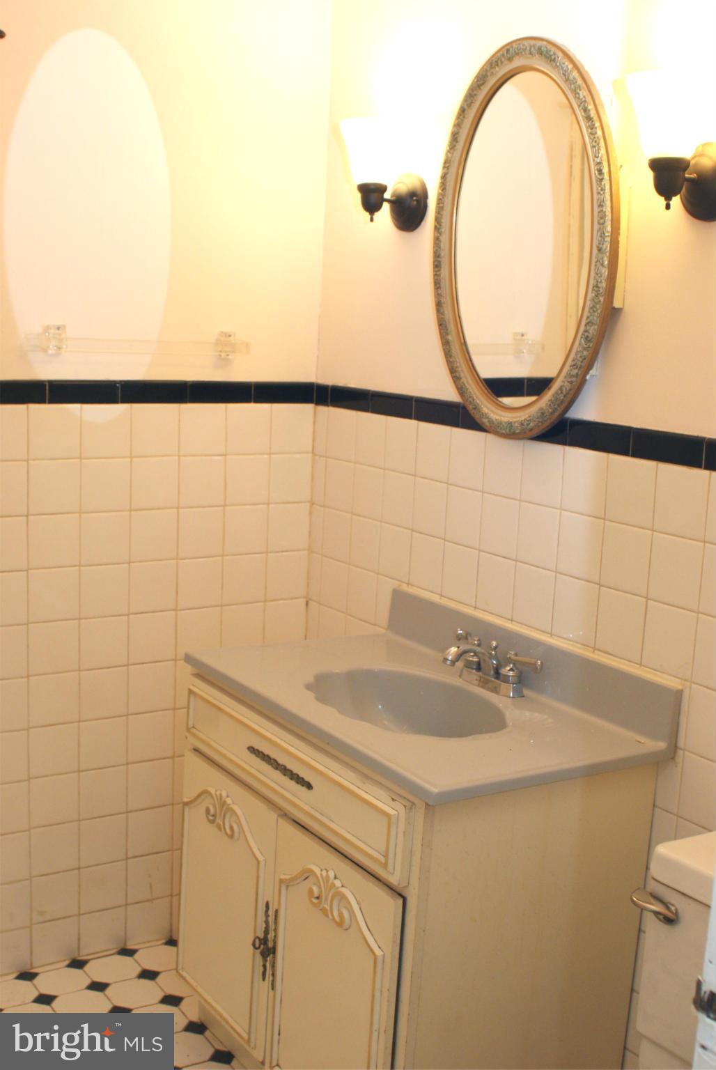 4505 Mahan Road Silver Spring, MD 20906 - Photo 10 of 22 a bathroom with a sink and a mirror