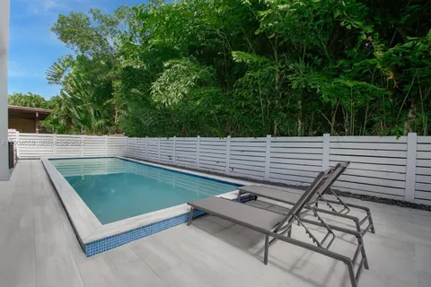 a bedroom with a bed and a ceiling fan