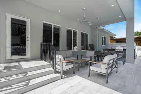 an aerial view of residential houses with outdoor space and street view