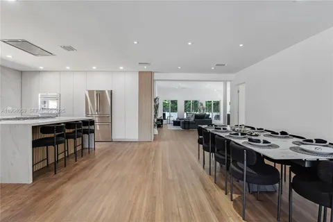 a kitchen with a sink a stove and cabinets