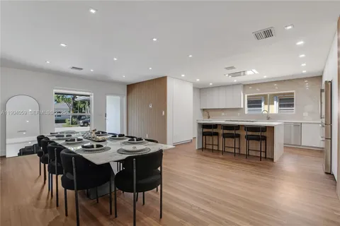 a kitchen with stainless steel appliances granite countertop a stove and a refrigerator